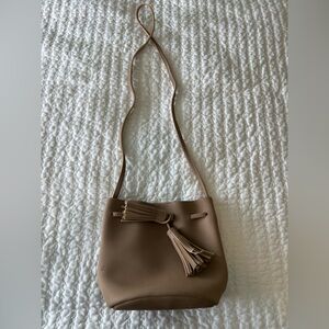 Taupe bucket bag, small pen mark (pictured), otherwise in great condition